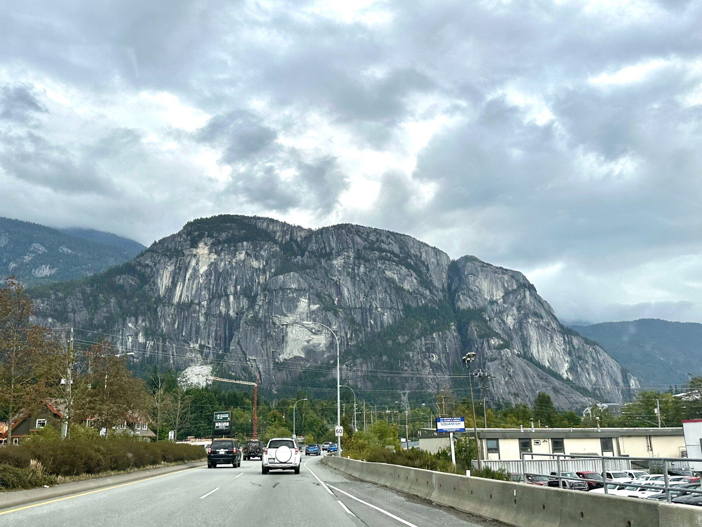 Image of the Squamish Chief taken through the front window of a car on the road